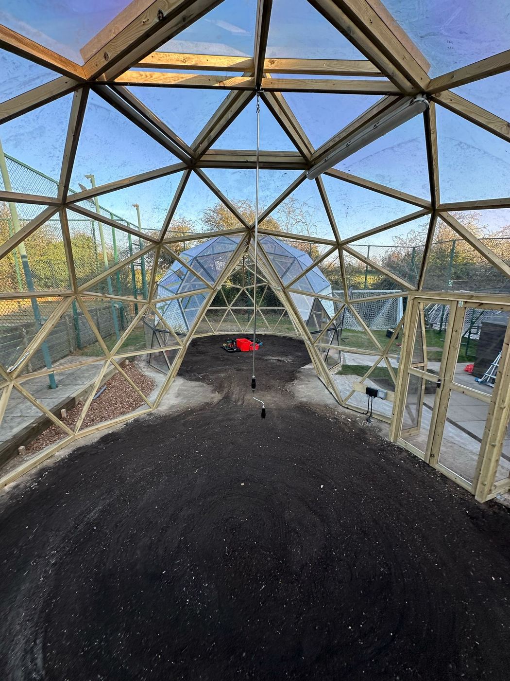 Looking through the growing tunnel between the two domes